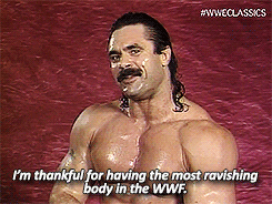 Video gif. Person with a muscular, bodybuilder physique, greased back hair, and a bushy mustache sweats profusely as he stares flirtingly at us. Text, "I'm thankful for having the most ravishing body in in the WWF."