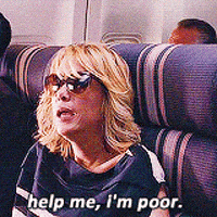 Movie gif. Kristen Wiig as Annie from Bridesmaids sits on a plane wearing sunglasses. She looks up at someone in the aisle and says, "Help me, I'm poor."