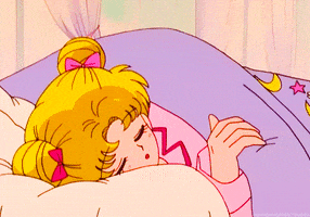 Anime gif. Sailor Moon snuggles under a purple comforter, then yawns and pulls the blanket over her head.