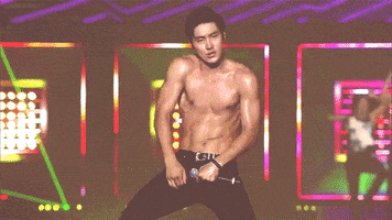 Celebrity gif. Siwon from Super Junior body rolls, shirtless, during a stage performance.