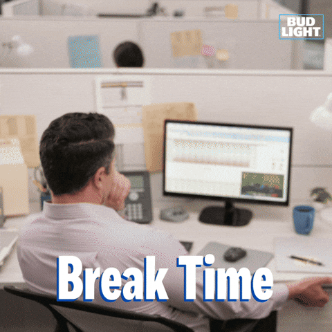 Sponsored gif. A man sits in front of a computer in a bland looking office. He opens a desk drawer which is full of ice and Bud Light cans. Text reads: "Break time. 