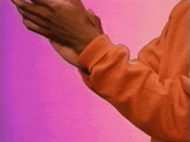 Video gif. Pair of hands is clapping to the beat.