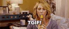 Celebrity gif. Kristen Wiig gives us the side eye before chugging wine straight from the bottle.