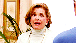 Arrested Development gif. Jessica Walter as Lucille Bluth with her mouth cracked open, nods at the person in front of her and raises her eyebrows.