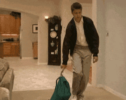 Arrested Development gif. Michael Cera as George Michael Bluth collapses face-down onto the floor in the hallway with his backpack.