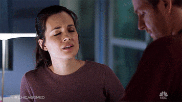 TV gif. An upset woman on One Chicago brings her face down to her hands in shame.
