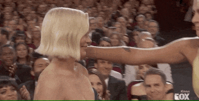 Emmys Michelle And Busy Hug GIF by Vulture.com