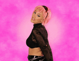 Celebrity gif. From a profile view, Doja Cat raises and flicks her right hand, coyly grinning and looking flattered. Text appears to fly out of her mouth, "Stop." 