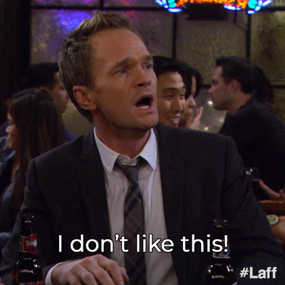 TV gif. Neil Patrick Harris as Barney in How I Met Your Mother yells at someone across the bar with an intensely concerned expression, mouthing the words below him, "I don't like this!"