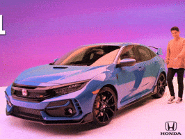 Ad gif. Young smiling man gets into a blue Honda Civic Type R, and text slides across the screen, reading "let's roll."