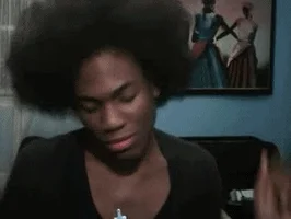 frustrated hair flip GIF