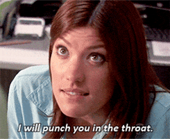 TV gif. Jennifer Carpenter as detective Deborah Morgan in Dexter looks up from her desk and flatly states, "I will punch you in the throat."