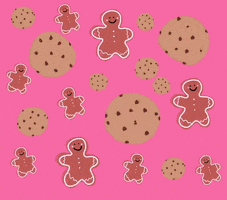 Digital art gif. Several smiling gingerbread men dance amongst chocolate chip cookies against a pink background.