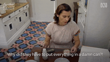 TV gif. Carole Ferrone in Back in Time for Dinner sits frustrated in a kitchen. Text, "Why did they have to put everything in a damn can?!" 