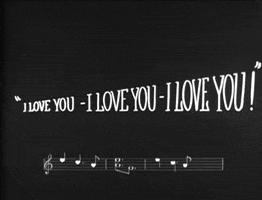 Text gif. Intertitle from a 1920s movie with quoted text that reads "I love you, I love you, I love you!" above a measure of musical notes.