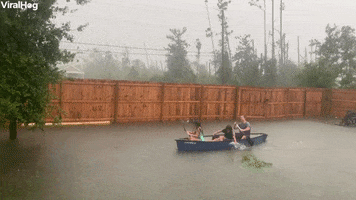 Family Turns Flooded Backyard Into Canoe Fun GIF by ViralHog
