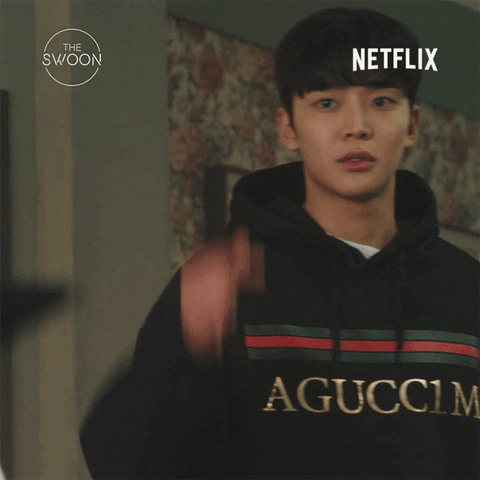 TV gif. Choi Joon-woong from "Tomorrow" wears a black Gucci hoodie, lowering his hand slowly and looking with a longing expression at someone offscreen. Text, "I love you."