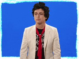Celebrity gif. Billie Joe Armstrong from Green Day face palms, covering his eyes, and animated action lines appear. 