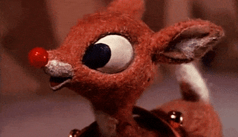 Stop motion gif. From the 1964 movie Rudolph the red-nosed reindeer nods his head as his nose blinks.