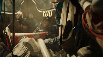 Movie gif. Actor Ryan Reynolds as Michael in Hitman's Wife's Bodyguard lays bloodied in a pile of wreckage and mayhem with the label "You." over his head. A metal pole labeled "life" tips onto him and smashes his already broken body.