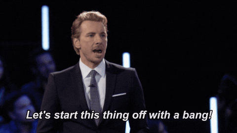 Dax Shepard talking to a crowd, caption reads, `Let's start this thing off with a bang!`