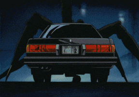 Anime gif. Red laser beam splits a car in half, making it violently explode into pieces right in front of us. In the background, a towering spider-like creature looms ahead.