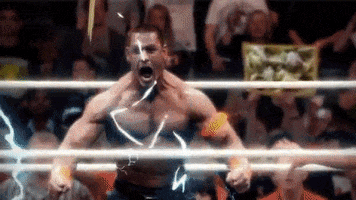 Sports gif. John Cena is in the ring roaring with power and he's edited to go Super Saiyan from Dragon Ball Z.