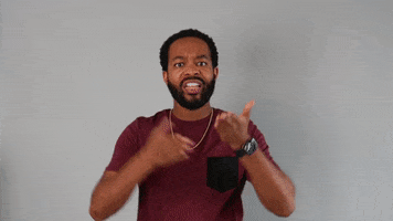 Celebrity gif. Tristen Winger points forward at us with both arms with a facial expression of frustrated but grateful validation as he says, "thank you."