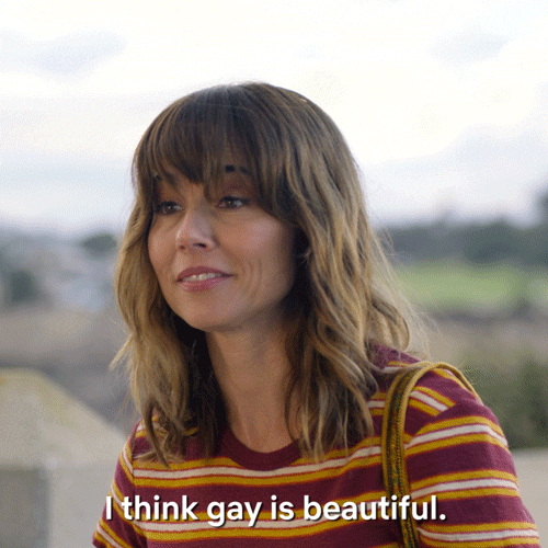 TV gif. Linda Cardellini as Judy Hale on Dead to Me looks at someone as she says, “I think gay is beautiful.”