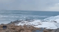 Cyclist Swept Off Bike by Crashing Waves in Northern Spain