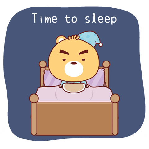 Kawaii gif. A Small bear with a big head lays under the covers in bed. He’s dressed in pajamas and pulls an eye mask over his eyes. He leans back and lays down. The lights flicker off. Text, “Time to sleep.”