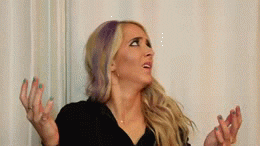 Jenna Marbles looks up into the air in confusion