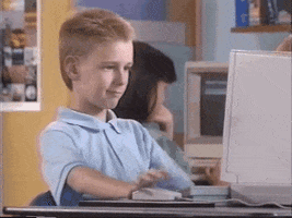 Ad gif. 1990s clip from an Apple Promo of Brent Rambo looking at a desktop computer nodding and smiling, then looking at us and giving a thumbs up.
