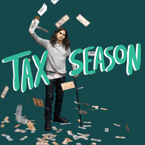 Video gif. Man holds up a cash cannon that sprays money as he leans on a cane in front of a jade green background. Text, "Tax season."