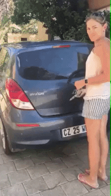 Video gif. Person opens the trunk of a car, releasing over a dozen beagle puppies barreling out of the trunk to hop down and run away along the pavement. 