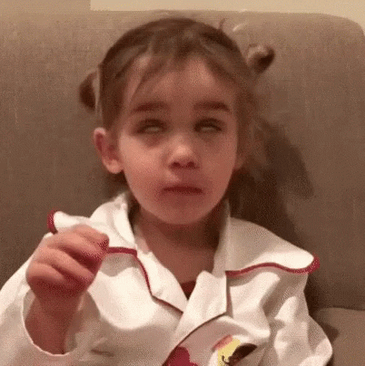 Video gif. A little girl with her hair in pigtails rolls her eyes and flops her hand over as if to say, "Yeah, right," or "as if!"