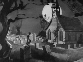 Disney gif. Black and white scene from The Skeleton Dance short. We see a graveyard and a spooky church as leaves billow in the wind.