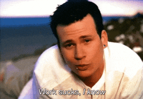 Music video gif. From Blink-182's All the Small Things video, Tom Delonge smiles at us and reveals a missing front tooth while singing "Work sucks, I know," which appears as text.