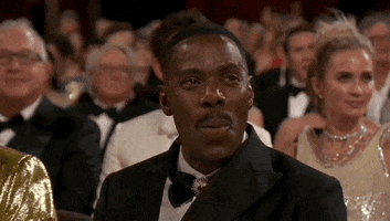 Oscars 2024 GIF. Colman Domingo, seated at the Oscars, nods emphatically, punctuating his agreement with, “Yep!”