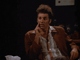 Seinfeld gif. Michael Richards as Kramer sits in a chair, pointing at someone and then pausing to blankly think. He says, “That’s true” and gives a worried smile. 