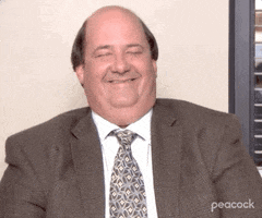 The Office gif. Brian Baumgartner as Kevin giggles with his eyes closed as his shoulders shudder with laughter during an interview.