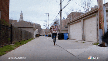 TV gif. On Chicago Fire Taylor Jackson as Kelly chases man down an alley, gaining on him quickly.