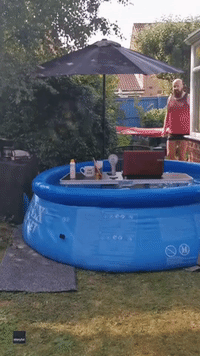 'Too Cool for Pool' Englishman Sets Desk in Water Amid Heatwave