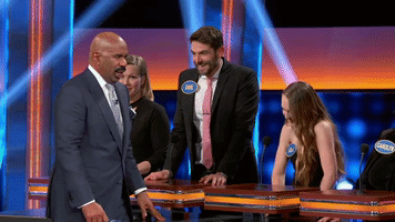 abcnetwork high five pass lola celebrity family feud GIF