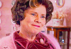 Close-up of Umbridge in her office, smiling