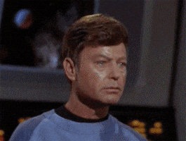 TV gif. William Shatner as Captain Kirk and DeForest Kelley as Bones from Star Trek, nodding to each other with understated smiles.
