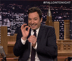 Tonight Show gif. Giggling as usual, Jimmy Fallon as host makes the "OK" hand gesture, then giddily closes his eyes and clutches his hands together.