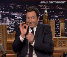 Tonight Show gif. Giggling as usual, Jimmy Fallon as host makes the "OK" hand gesture, then giddily closes his eyes and clutches his hands together.