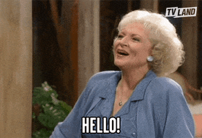 TV gif. Actor Betty White as Rose Nylund on Golden Girls joyfully smiles and says "Hello!'