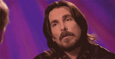 Celebrity gif. Christian Bale spaces out in an interview before furrowing his eyebrows in confusion.
